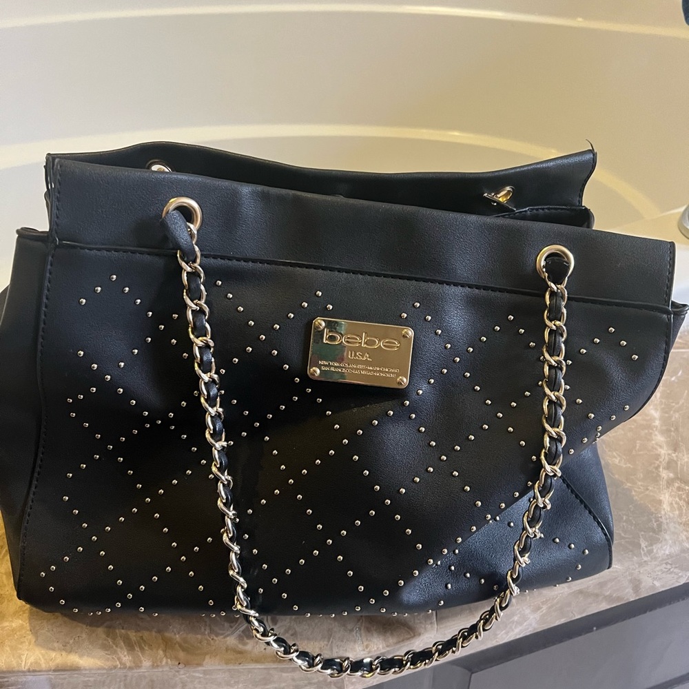 Bebe purse, black with gold detail, faux leather.